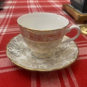 Elegant Gold and White Floral Teacup and Saucer Set